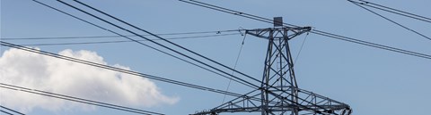 A peak of electronic tower against blue sky.