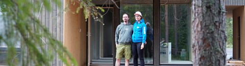 Kaisa and Jari, the builders of the detached house, stand together on the terrace of their new home.