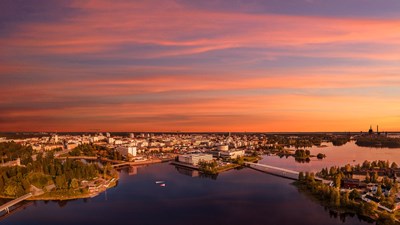  Aerial view of the center of Oulu during the orange-red sunset.