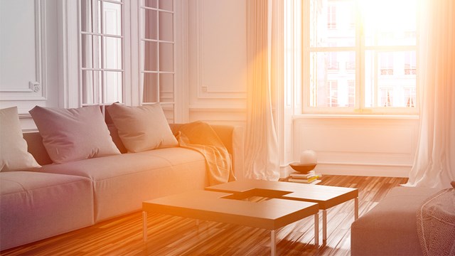 Warm sunlight filters into the living room.