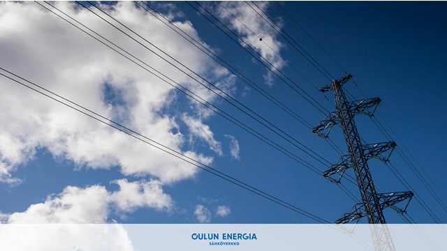 A power line against a blue sky. There are puffy clouds in the sky.